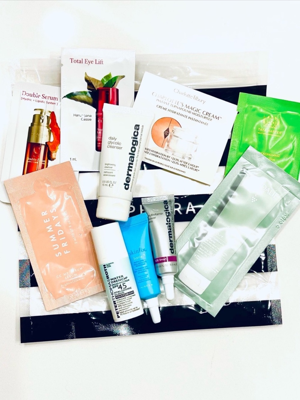 Clarins Moisturizer and Skincare Sample Assortment - White, Peach, Green, Blue